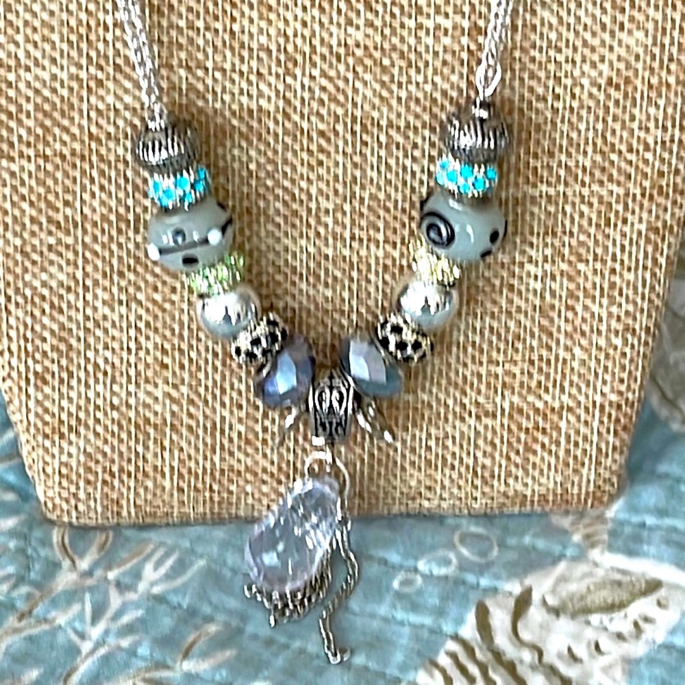 Interesting necklace with handmade glass beads and crystal embellished findings